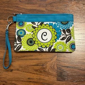 Pouch wristlet with the letter C. Floral print of lime green and turquoise.